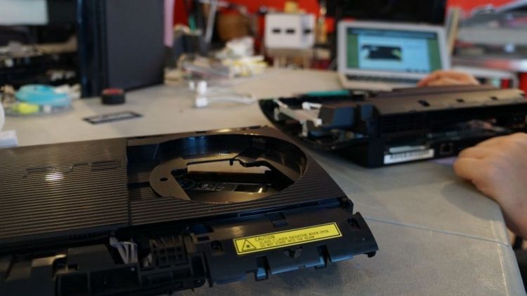 PlayStation 3 Super Slim with the case removed during repair